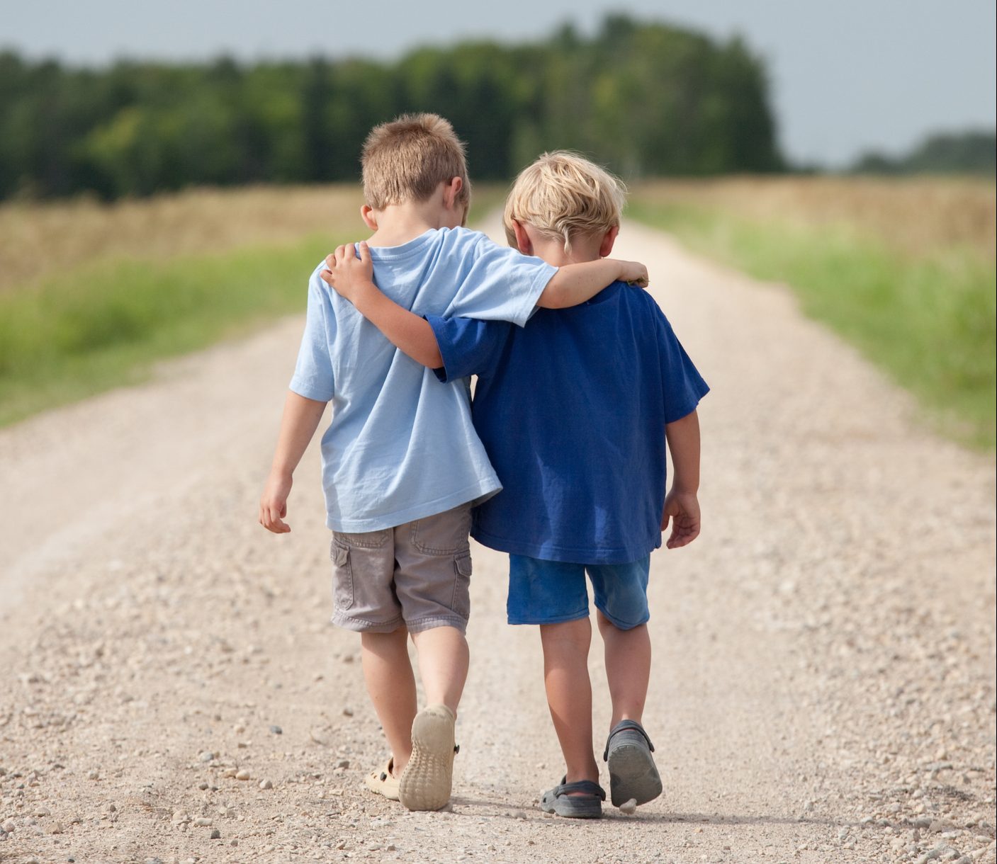 Two Boys Walking Down A Gravel Road Childrens Hearings Improvement